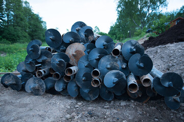 Metal piles for construction. The piles are piled up, ready to go