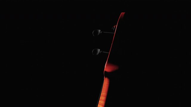 Carved head of Cello or Fiddle on black background isolated. Loop footage with violin and copy space at left area - Video for Music events, Workshops, education ads and Music stores.