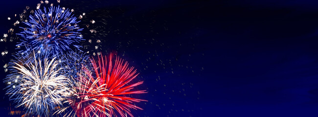 Fireworks banner, colorful sylvester-fireworks on blue background with sparks and space for text.  Independence day USA - obrazy, fototapety, plakaty