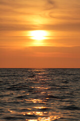 Evening sun over the tropical sea with waves