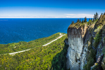 View on cliffs, the route 132 and the Atlantic ocean from the Perc&eacute; Unesco Geopark, near the famous Perc&eacute; Rock in Gaspesie (Quebec, Canada)