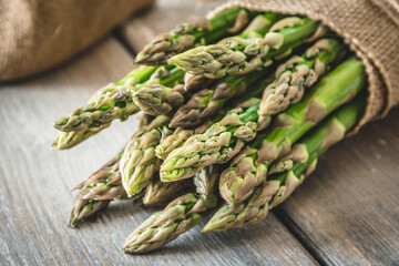 Green asparagus on a rustic wooden table
