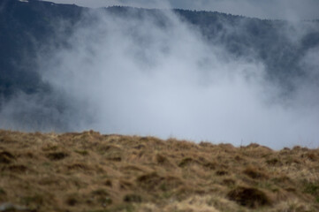 Fototapeta na wymiar Fog on a mountain range in the Carpathian mountains