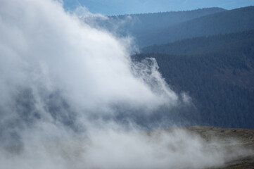 Fog on a mountain range in the Carpathian mountains