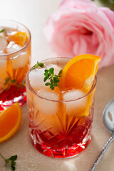 Summer cocktail with strawberries, oranges and fresh herb, delicious homemade lemonade with syrop