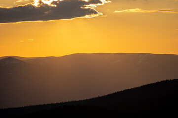 Beautiful orange sky during dusk in the carpathian mountains