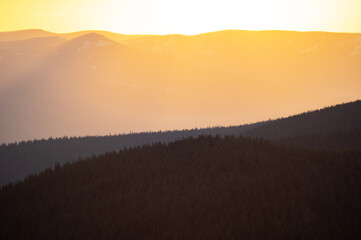 Beautiful orange sky during dusk in the carpathian mountains