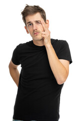 Young handsome tall slim white man with brown hair crumpling his face in black shirt isolated on white background
