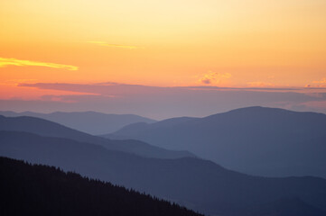 Beautiful orange sky during dusk in the carpathian mountains