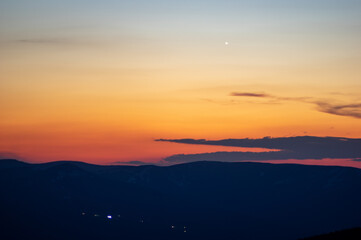 Beautiful orange sky during dusk in the carpathian mountains