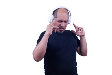 Sitting in studio of man grimacing and holding objects, on a white background.