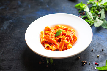 pasta tomato sauce vegetables ziti or penne macaroni dish italian cuisine classic on the table healthy food meal snack copy space food background rustic top view veggie vegan or vegetarian food