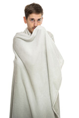 Young handsome tall slim white man with brown hair covered with blanket isolated on white background