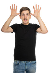 Naklejka premium Young handsome tall slim white man with brown hair doing antlers gesture in black shirt in blue jeans isolated on white background