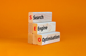 SEO search engine optimisation symbol. Wooden blocks with words 'SEO search engine optimisation' on...