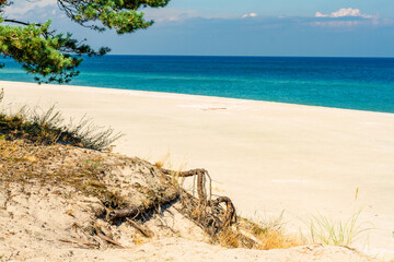 Summer landscape. A lonely beach with white sand and blue sea. View of Baltic sea coast.  Hel Peninsula, Hel, Pomerania, Poland