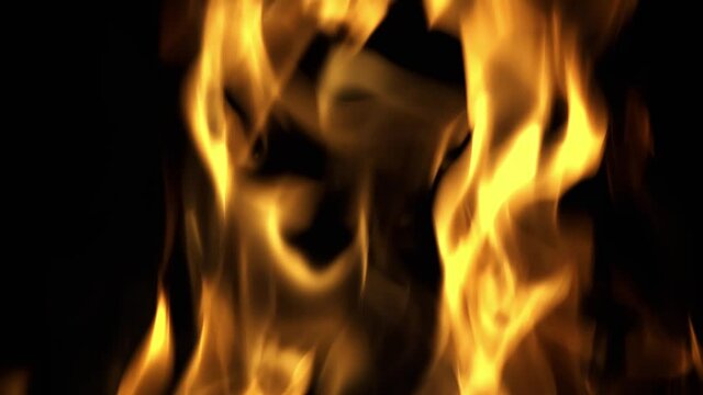 Background of flame close-up on black background. Slow motion in four times.