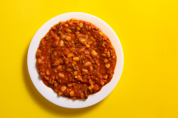 Traditional Hot chili sauce. Chopped meat, white beans, korn pepper, paprika in a tomato sauce. on...