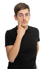 Young handsome tall slim white man with brown hair making creepy face in black shirt isolated on white background