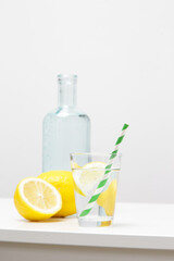 Lemon water with bamboo straw. Healthy detox drink. Reusable bamboo straws as an alternative for single-use plastic straws, healthy and sustainable lifestyle concept