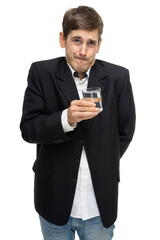 Young handsome tall slim white man with brown hair with glass full of water in black blazer isolated on white background