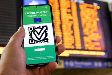 Vaccination passport on the smartphone screen for traveling