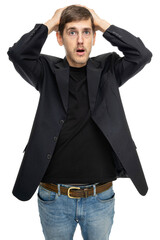 Young handsome tall slim white man with brown hair looks helpless holding his head in black blazer...