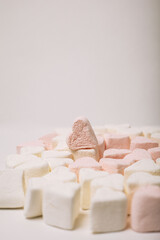 Marshmallows. Background or texture of colorful mini marshmallows.
pink marshmallow in the form of a heart.