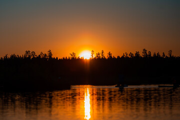 Fototapeta na wymiar Sunset on the lake or swamp