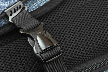 Semi-automatic fastener for connectiong fabric tapes of the travel backpack exuipment concept, close-up background photo