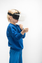 Fototapeta premium Blonde boy in virtual reality 3d glasses. Isolated on white background. Vertical frame