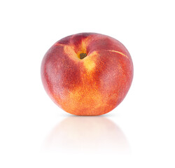 Nectarine fruit isolated on white background with shadow and reflection.