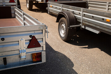 A store that sells trailers.Car open trailer. Transport for cargo transportation.