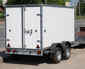 A store that sells trailers.Car open trailer. Transport for cargo transportation.