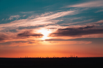 Fototapeta na wymiar Sunset at the industrial city.