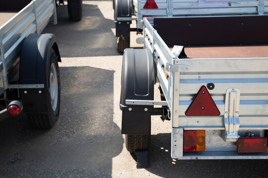 A store that sells trailers.Car open trailer. Transport for cargo transportation.