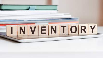 the word inventory is written on wooden cubes, concept - obrazy, fototapety, plakaty