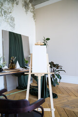 White canvas on an easel. Art. Empty picture