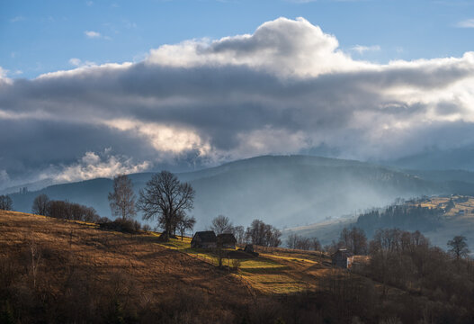Picturesque morning above late autumn mountain countryside.  Ukraine, Carpathian Mountains. Peaceful traveling, seasonal, nature and countryside beauty concept scene.