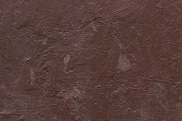 Old dark red ugly scratched concrete wall texture.