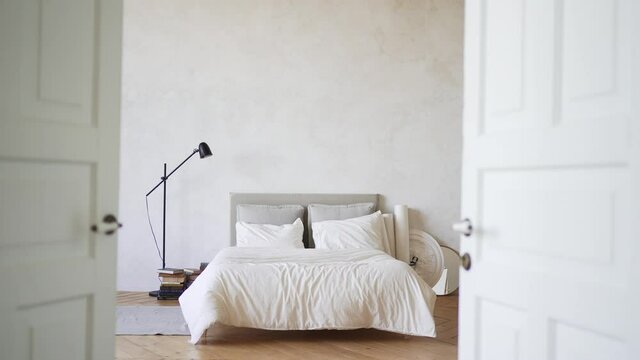 Bedroom with a bed. The interior of modern Scandinavian-style apartments