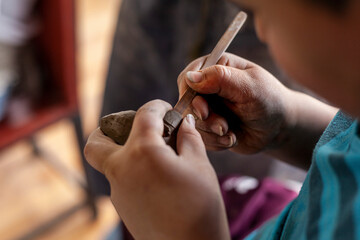 close up of hands of a potter