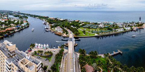 aerial drone shot of Hillsboro Inlet, Florida with bridge in city