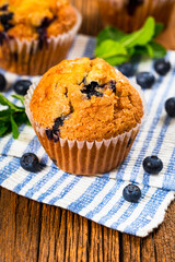 Muffins with Blueberries and Fresh Blueberries. Selective focus.