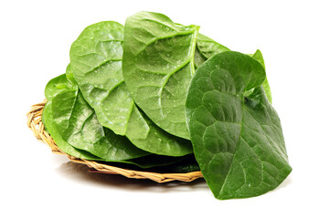 Stack of fresh malabar spinach vegetable leaves on white background