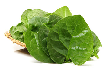 Stack of fresh malabar spinach vegetable leaves on white background