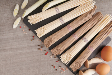 Uncooked soba and udon noodles. Traditional Japanese noodles, Raw food ingredient. Dried buckwheat soba and udon noodles.