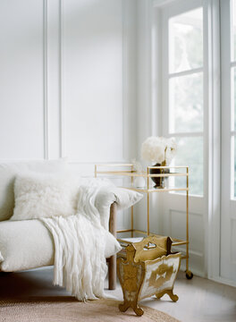 White interior with brass touches for a brightly lit home