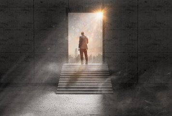 Opportunity of businessman standing on staircase to looking door with sun light,leader concept...