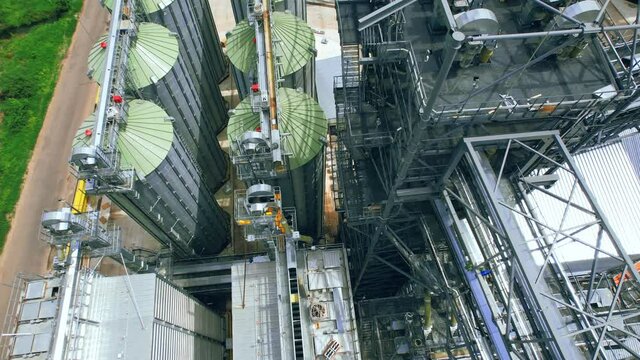 Dron view industrial crane on background factory. Industry factory plant. 4k stock footage.
